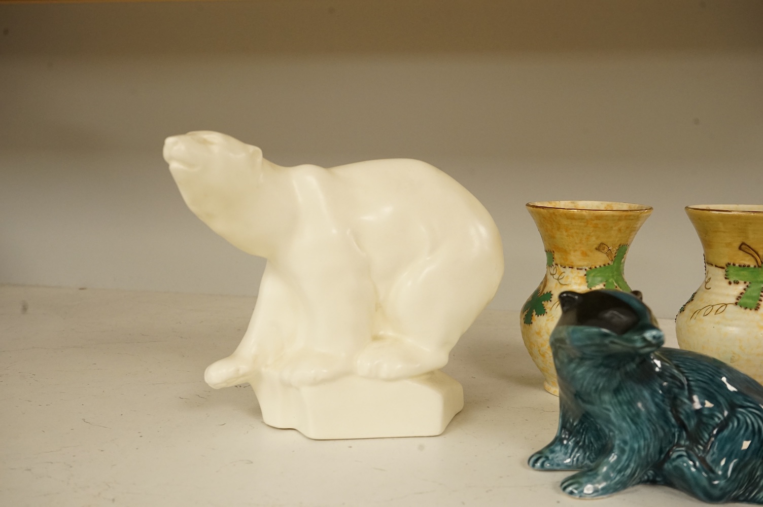 A Roy Smith Wedgwood polar bear, Poole pottery badger, Beswick bull and pig, together with other collectables, largest 17cm high